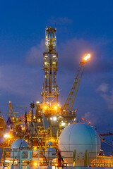 Oil drilling rig with the flair boom.