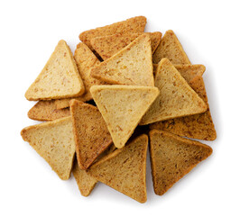Heap of triangular chips, hummus snack close-up on a white. Top view