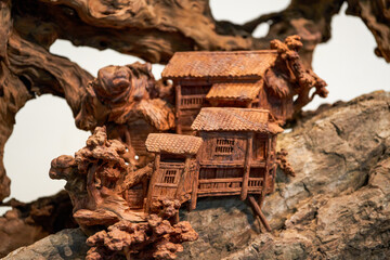 Close-up of delicate miniature wooden root carvings