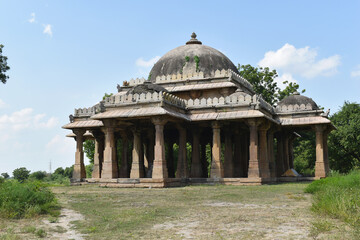 View from left - Cenotaph - Maqbara Octagonal pillars and dome side of Alif Khan Masjid, It was build in 1325 AD by Alif Bhukai in Dholka, Gujrat, India.