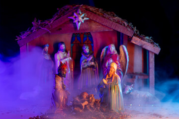 Christmas birth of Jesus. Christmas manger scene with figurines including Jesus, Mary, Joseph,...