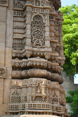 Rani Sipri's Mosque also known as Rani Sipri ni Masjid or Masjid-e-nagina, exterior Minaret stone carving details, left view,  Ahmedabad, Gujrat, India...