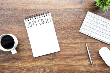 Notebook with 2023 goals text on it to apply new year resolutions and plan.