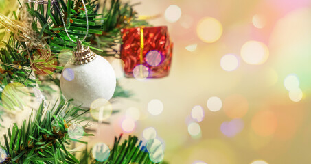 Decorated Christmas tree on blurred background.background Xmas design of bokeh lights gift.