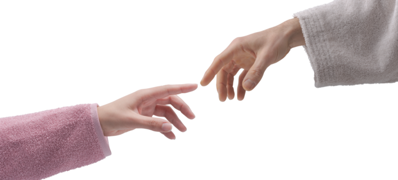 Man and woman in bathrobe touching fingers