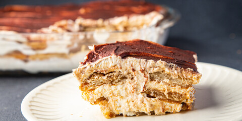 Tiramisu savoiardi, mascarpone, amaretto sweet dessert meal food snack on the table copy space food background 