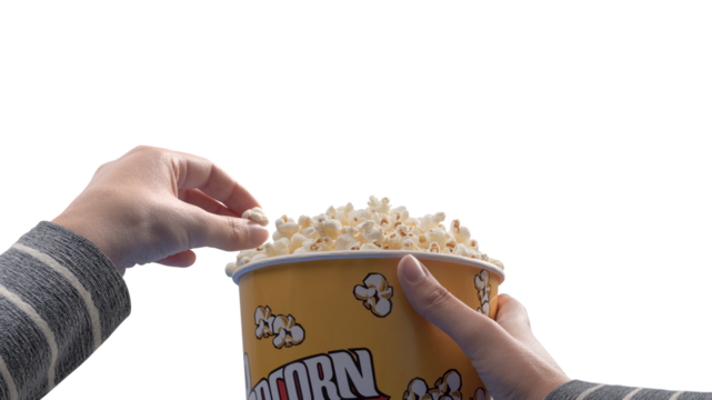 Woman eating popcorn at the movie theater