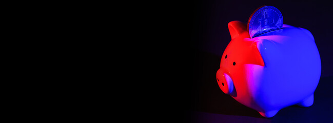 Piggy bank with Bitcoin on a dark background with red-blue backlight. Banking concept. Bitcoin mining concept. Banner