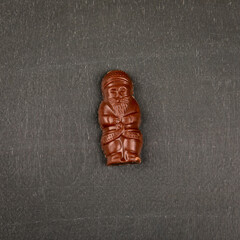 Chocolate Santa candy on a dark chalkboard background