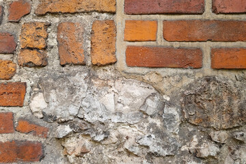 The old brick wall of the building, the architecture, the texture of the wall.
