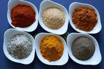 Spices close-up on blue background. 