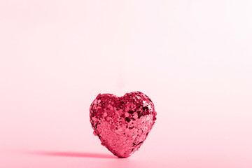A heart made of copper sequins. Valentine's Day greeting card. Color 2023, viva magenta.
