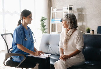 Doctor and patient discussing something while sitting at the table . Medicine and health care concept.