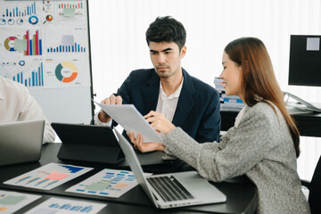 Group of Asian business meeting in planning design in creative business discussing work in the office.