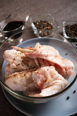 Chicken wings in soy sauce to prepare Asian cuisine with teriyaki sauce.