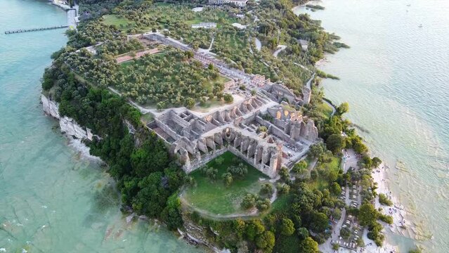 Grotte di Catullo in Sirmione, Lake Garda aerial view during beautiful sunset.
Lake Garda ancient museum in Sirmione, Italy, with beautiful landscape and beach with crystal clear water.