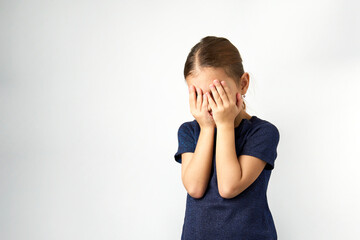 Little girl covering her eyes with her hands