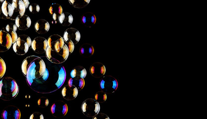 soap bubbles on black background with copy space for text or image , abstact background , celebration concept.