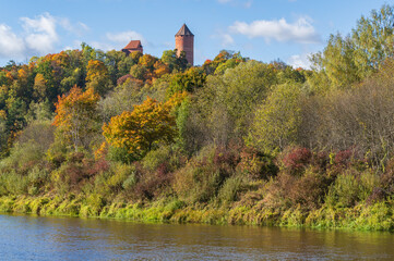 View to Turaida Castle on sunny autumn day. River of Gauja in the foreground