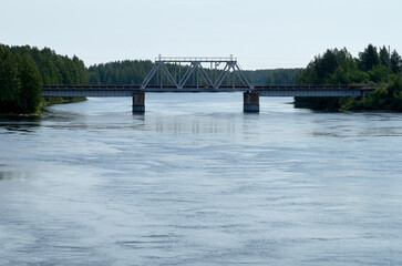 View of the steel railway bridge over a small river