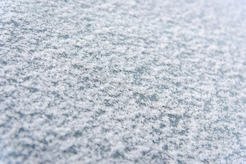 Frosted background.Abstract frosty pattern on glass.Winter snow background.Frosty patterns on the glass with empty space for text.