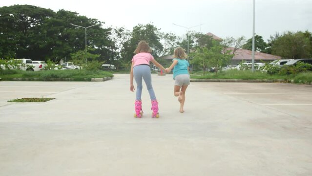 Girl rollerblading on asphalt in the park