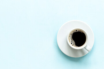 White cup of hot black coffee top view. Coffee break time concept