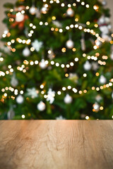 Christmas table background with christmas tree bokeh