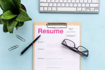 Searhing for a new job. Resume application form on office table