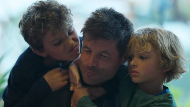 Children hugging father two kids loving dad authentic real life family love