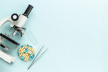 Nutritional science concept with medical drugs and microscope in the lab