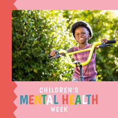 Composition of children's mental health week text and boy on bike