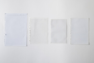 White pieces of notebook with copy space on white background