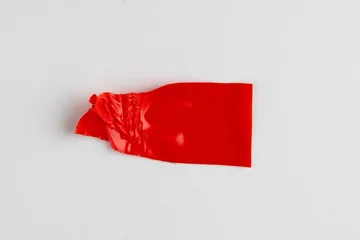  Ripped up piece of red tape with copy space on white background © vectorfusionart