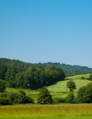 Fototapeta na wymiar Hills, fields and meadows - beautiful landscape of Wiezyca.
