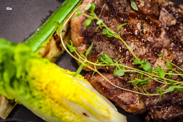 Black Angus Entrecote steak. Marbled steak from Uruguay. Delicious healthy traditional food closeup served for lunch in modern gourmet cuisine restaurant