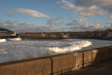 Fototapeta na wymiar winter waves at Eyemouth harbour in winter