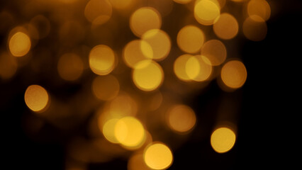 Abstract background of blurred yellow lights for design. Lights bokeh dis focus. Christmas background, copy space