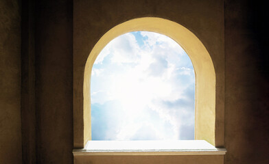 Sunlight through the arch window. Old historic building wall background. Ancient frame architecture. Looking at the sky from the medieval castle.