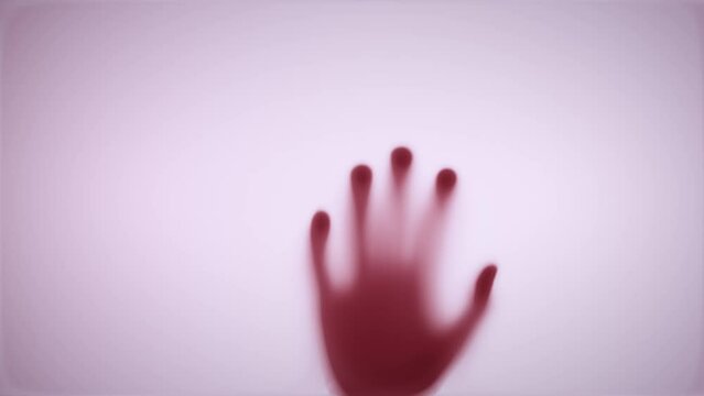 shadows of the hand hit the door and slowly crawled down. The concept of violence, victim, thriller, horror