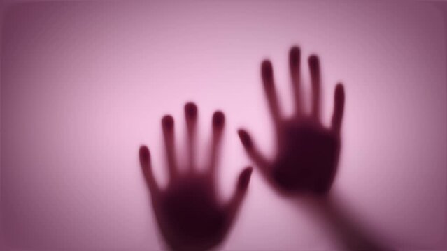 shadows of hands hit the glass. Thriller, horror, violence concept