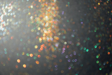 Abstract background of blurred colorful glitter for design. Lights bokeh dis focus. Christmas, festival background, copy space