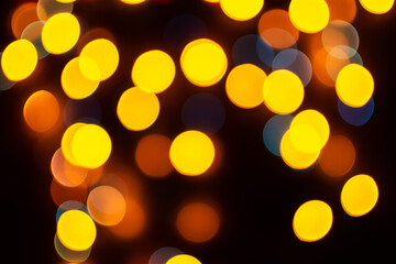 Christmas defocused lights, blurred colorful lights on a dark background, festive background