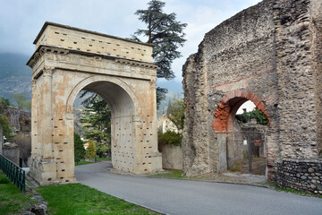 Susa, Piedmont, Italy -10-22-2022- The Roman triumphal arch in honor of Octavian Augustus datable to the 1st century AD