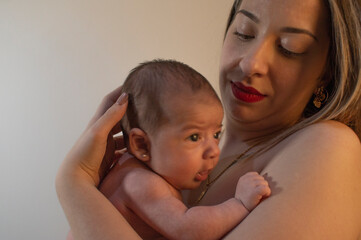 Baby in mother's arms.