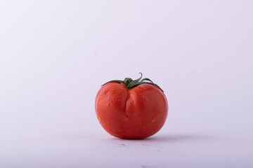 Tomato isolate. Tomatoes on a white background. angle 45 view of tomatoes with Parsley leaf, side view.
