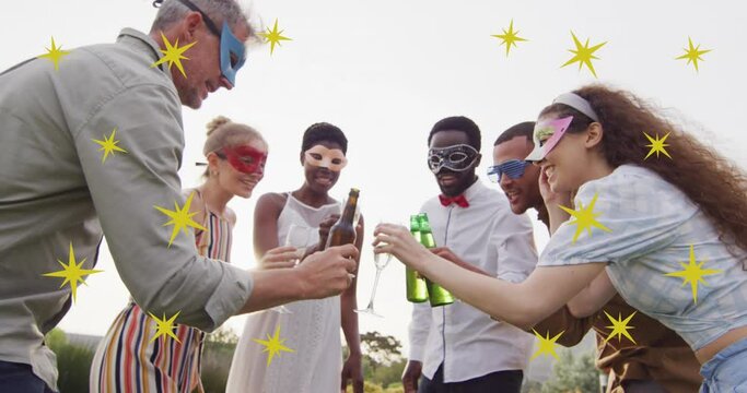 Animation of christmas stars over diverse friends wearing masks at party and making toast