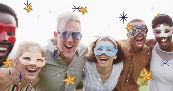 Animation of christmas star over diverse friends wearing masks at party