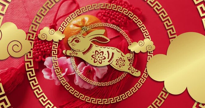 Animation of chinese pattern and rabbit year decoration on red background