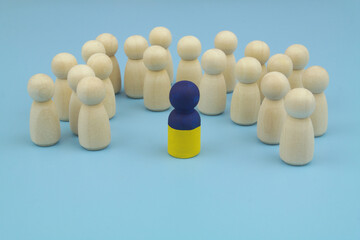 Leader with colors of Ukrainian flag and many people figures on blue background.